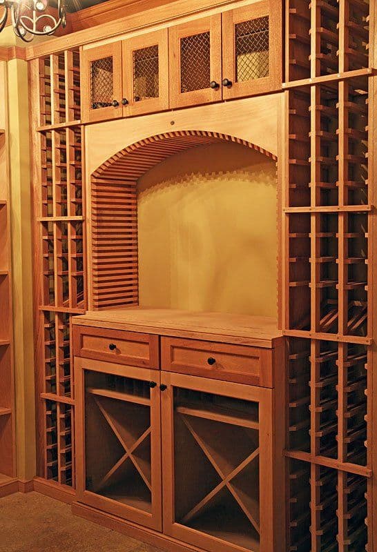 Wooden wine rack with storage drawers and cabinet, featuring elegant design and craftsmanship.