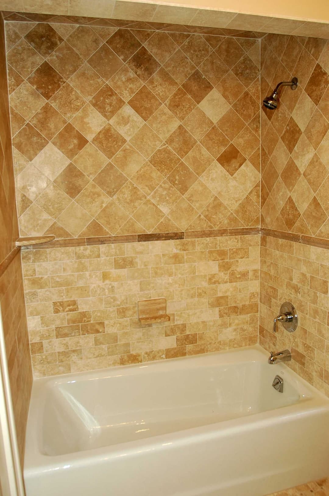 Stylish bathroom with a beige tile shower and a modern white bathtub. Elegant design elements.